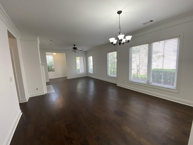 spare room featuring ceiling fan with notable chandelier, dark hardwood / wood-style flooring, plenty of natural light, and crown molding