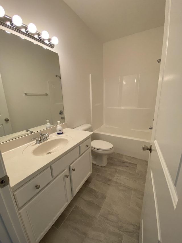 full bathroom featuring shower / bathing tub combination, vanity, and toilet