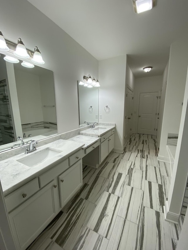 bathroom featuring vanity and a tub to relax in