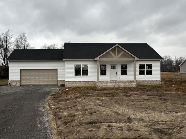 view of front of property with a garage