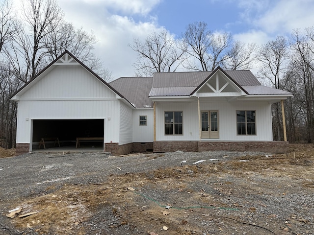 view of front of home featuring a garage and french doors