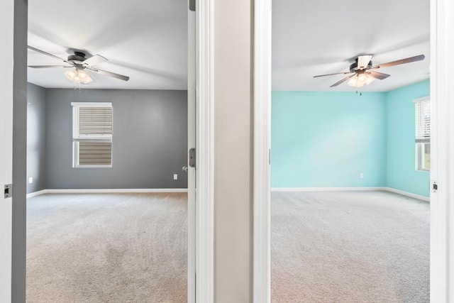 spare room with light carpet and ceiling fan