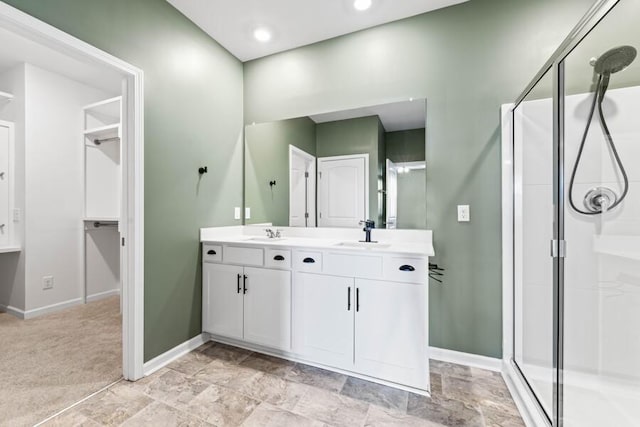 bathroom featuring vanity and walk in shower