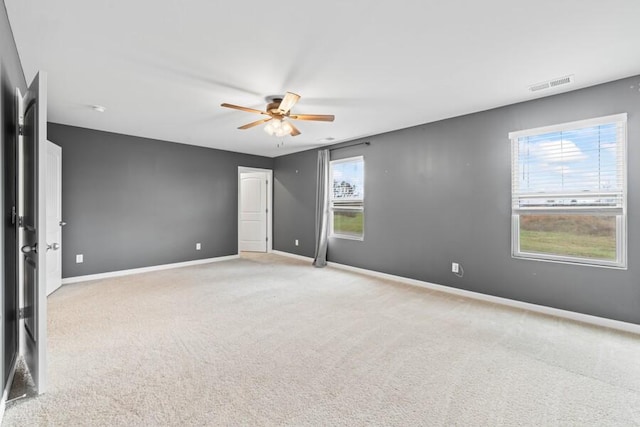 empty room with light carpet and ceiling fan