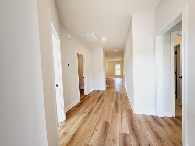 corridor featuring light hardwood / wood-style floors