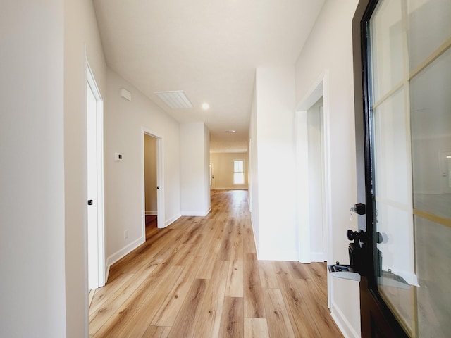 hallway featuring light hardwood / wood-style flooring