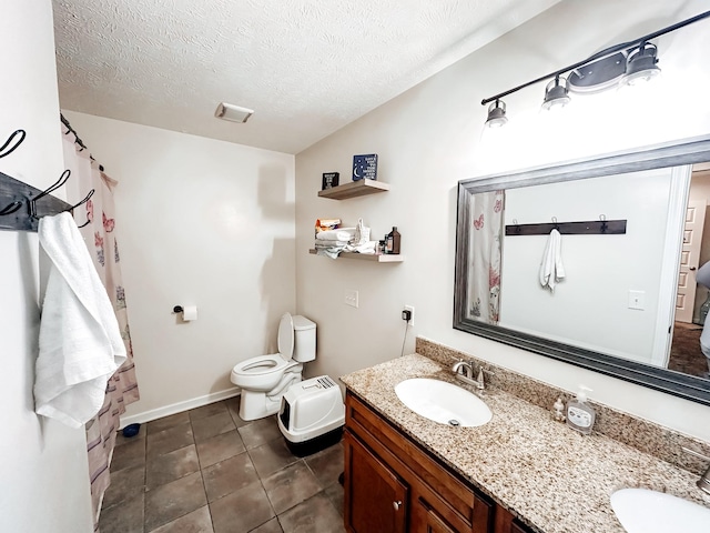 bathroom featuring a textured ceiling, vanity, a bidet, tile patterned flooring, and toilet