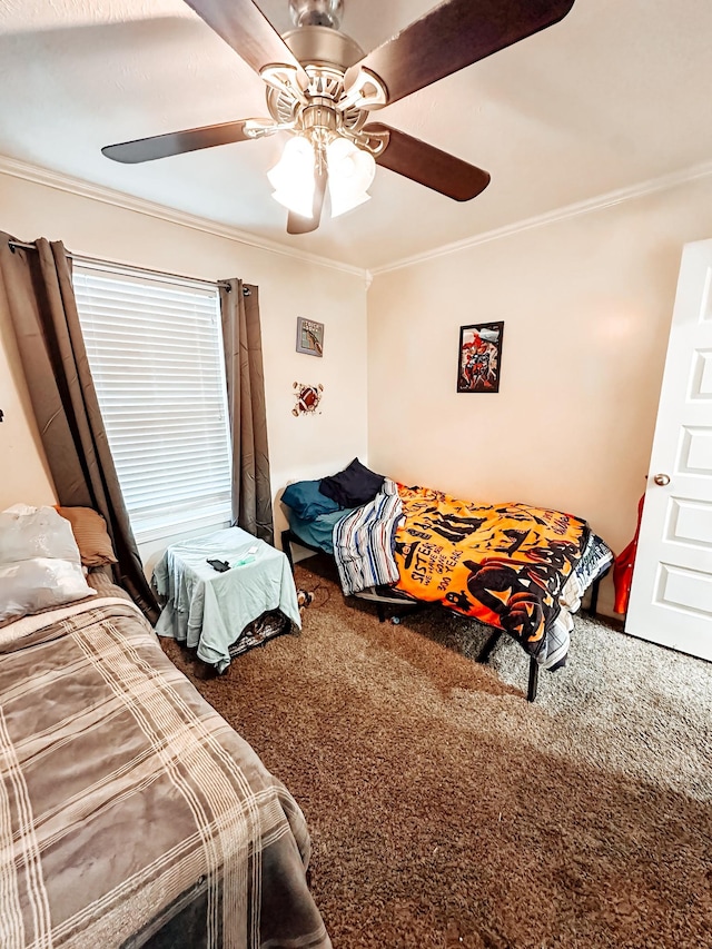 bedroom with carpet, ceiling fan, and crown molding