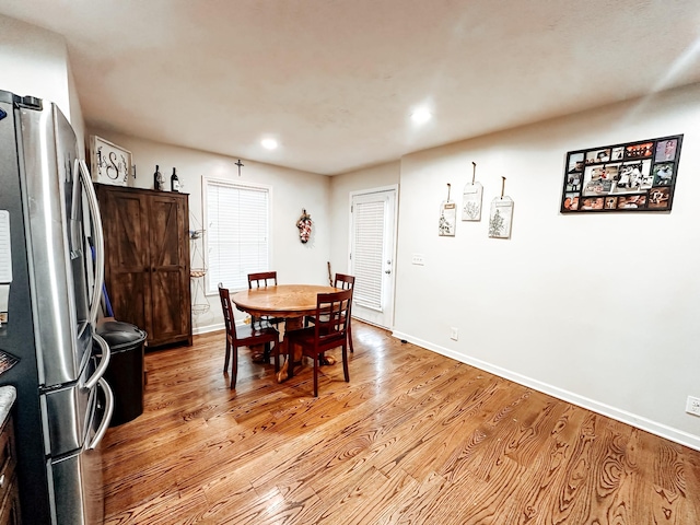 dining area with light wood-type flooring