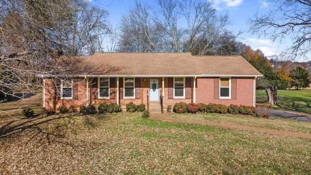 ranch-style house with a front lawn