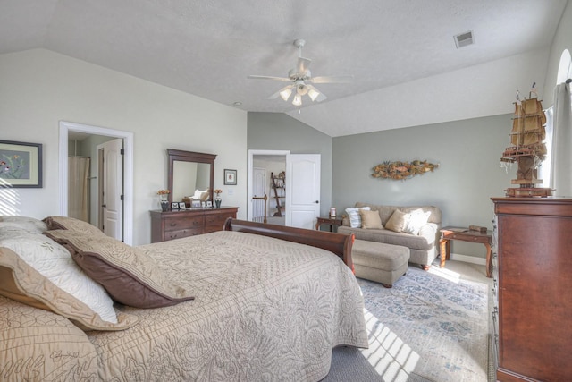 carpeted bedroom featuring vaulted ceiling and ceiling fan