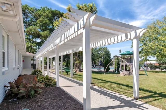 view of patio featuring a pergola and a playground