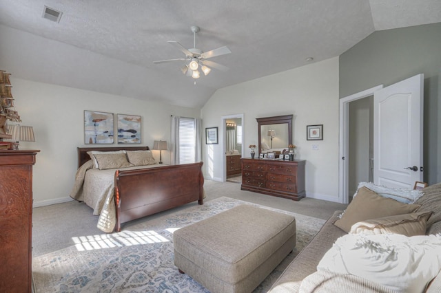 bedroom featuring a textured ceiling, ceiling fan, light colored carpet, and vaulted ceiling