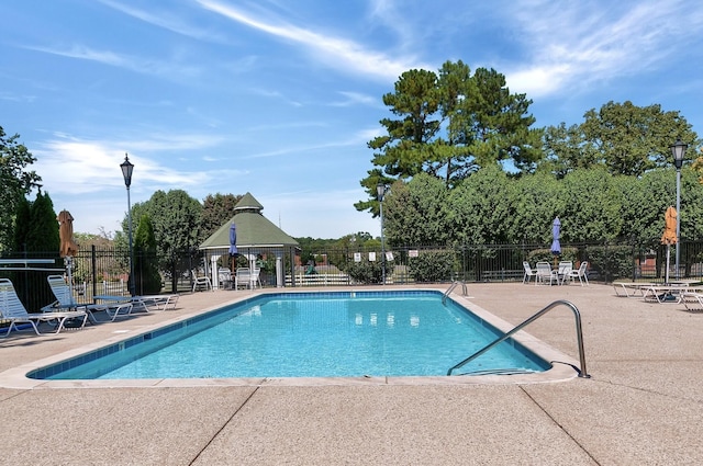 view of swimming pool featuring a gazebo and a patio area