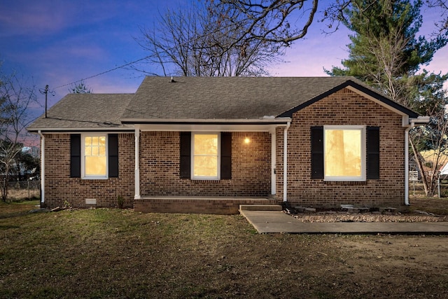 view of front of property with a yard