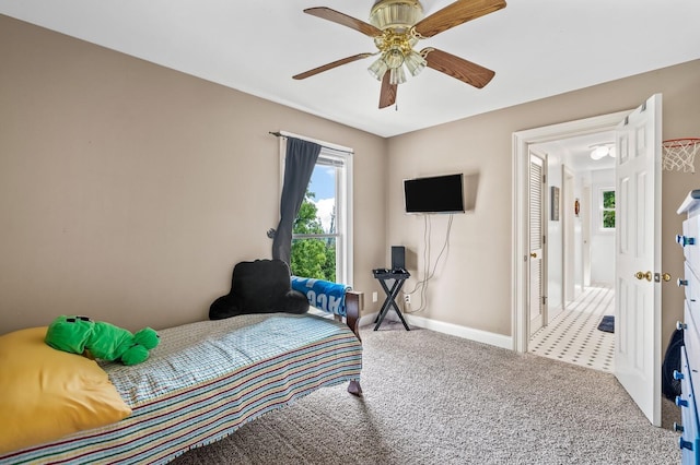 bedroom with ceiling fan and carpet floors