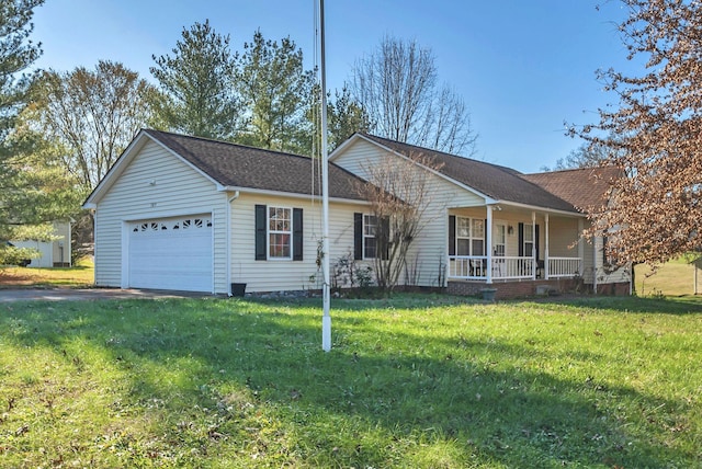 ranch-style house featuring covered porch, a front yard, and a garage