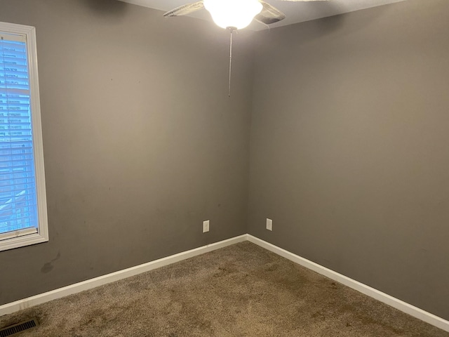 spare room with ceiling fan and carpet flooring