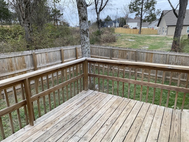 wooden terrace with a yard