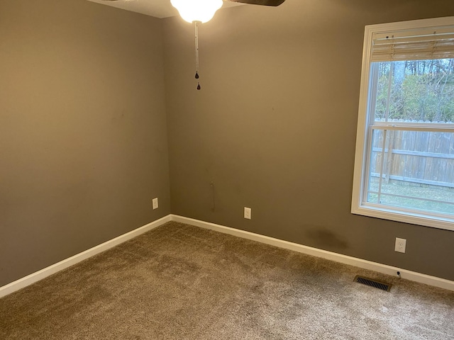 unfurnished room with carpet floors