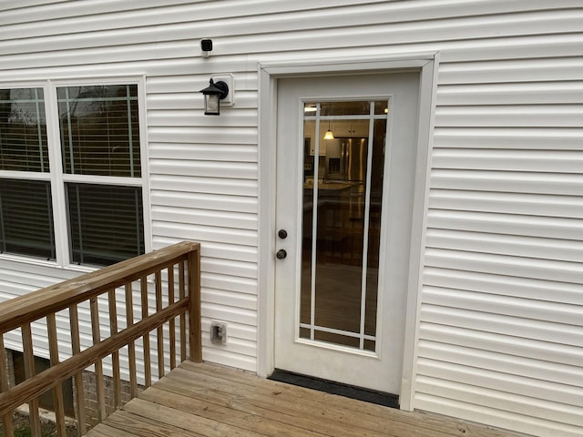 entrance to property with a deck