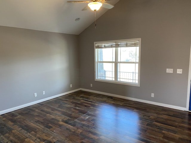 unfurnished room with dark wood-type flooring, ceiling fan, and vaulted ceiling