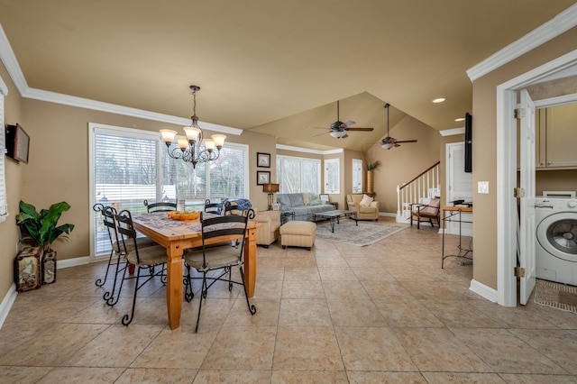 dining space with plenty of natural light, ornamental molding, vaulted ceiling, and washer / dryer