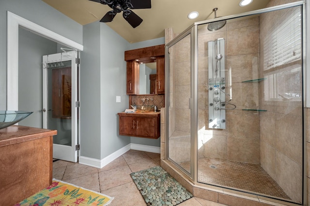 bathroom with ceiling fan, tile patterned flooring, and a shower with shower door