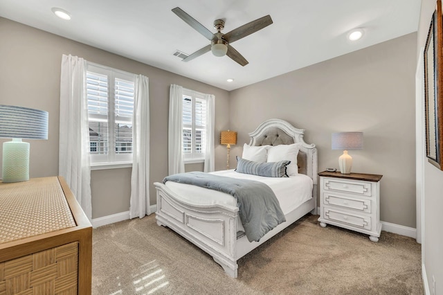 bedroom with light carpet and ceiling fan