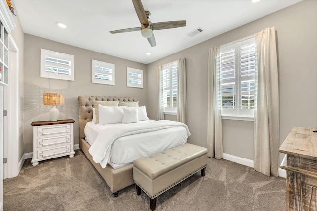 bedroom with ceiling fan and dark carpet