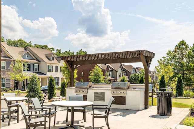 view of patio with area for grilling, a pergola, and grilling area