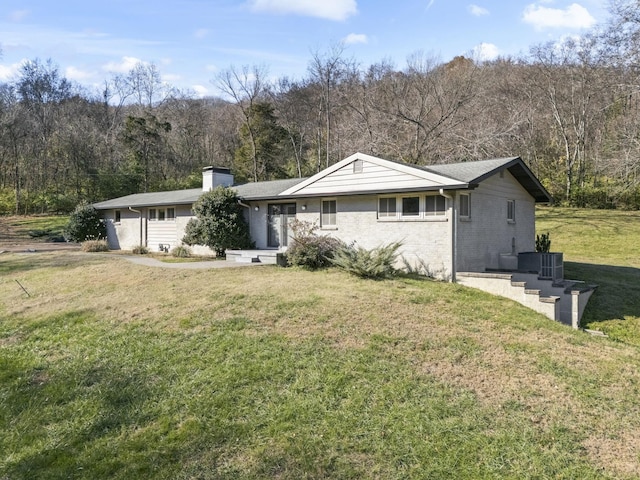 ranch-style house with a front lawn