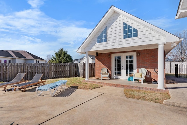 back of house with a patio area and french doors