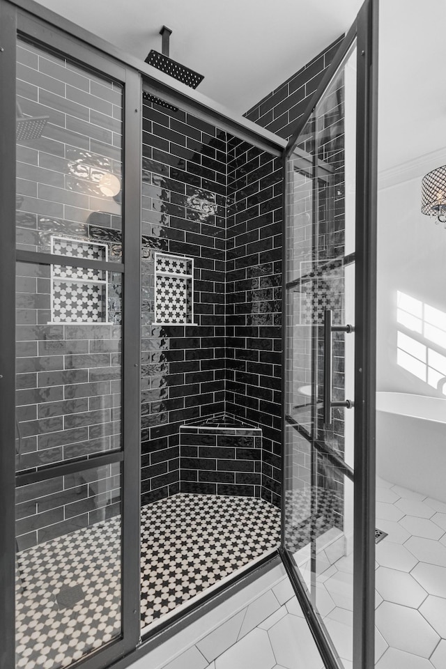 bathroom featuring tile patterned flooring and walk in shower