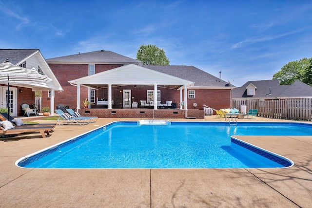 view of swimming pool with a patio