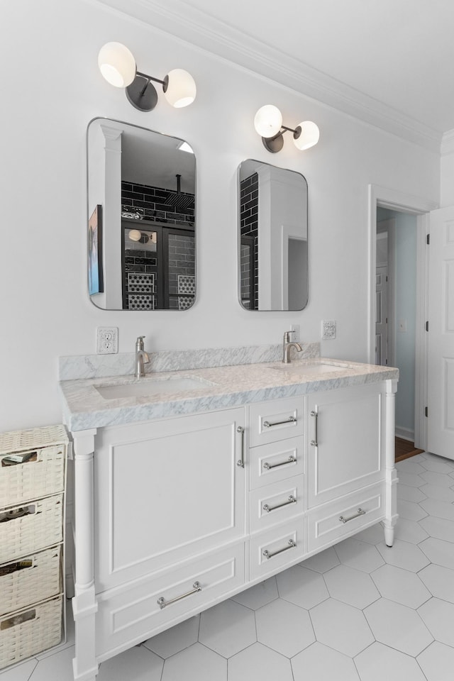 bathroom with ornamental molding and vanity