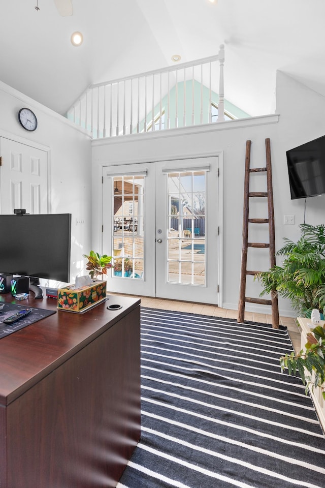 home office featuring lofted ceiling and french doors