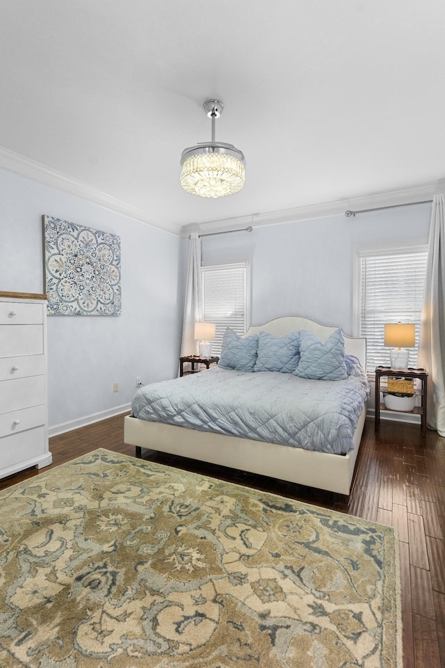 bedroom featuring multiple windows, crown molding, and dark hardwood / wood-style floors