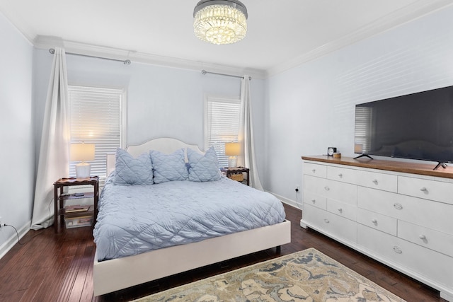 bedroom with an inviting chandelier, crown molding, and dark hardwood / wood-style floors