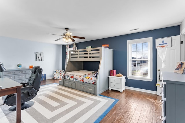 bedroom with hardwood / wood-style flooring and ceiling fan