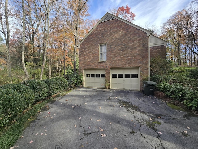 view of side of home with a garage