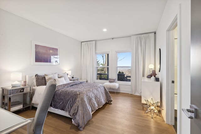 bedroom with light hardwood / wood-style floors