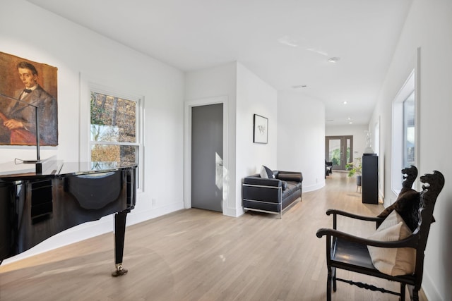 sitting room featuring light hardwood / wood-style flooring