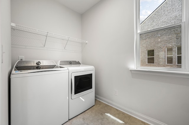 washroom featuring washer and dryer