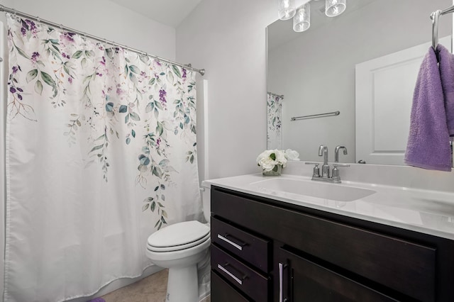 bathroom featuring vanity, toilet, and curtained shower