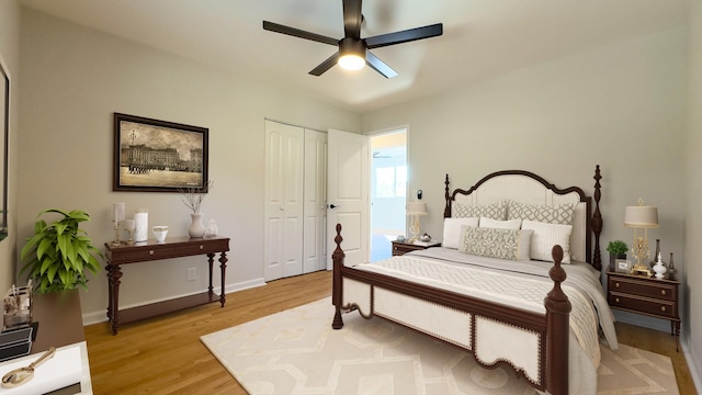 bedroom with ceiling fan, light wood-type flooring, and a closet