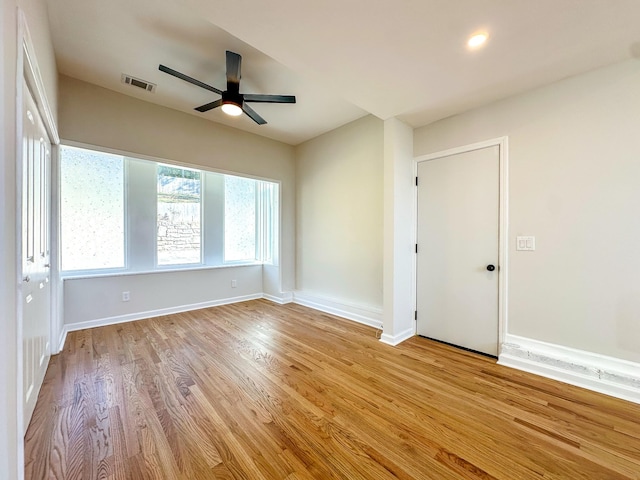 unfurnished room featuring ceiling fan and light hardwood / wood-style flooring