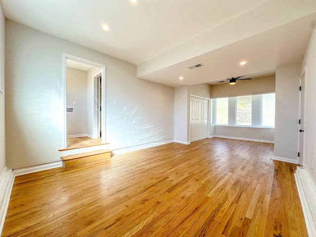 unfurnished room featuring ceiling fan and light hardwood / wood-style floors