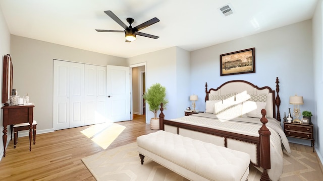 bedroom with ceiling fan, a closet, and light wood-type flooring