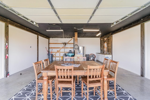 dining room with concrete flooring